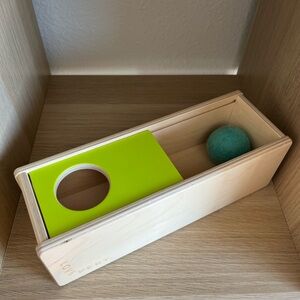 Lovevery slide top ball toy